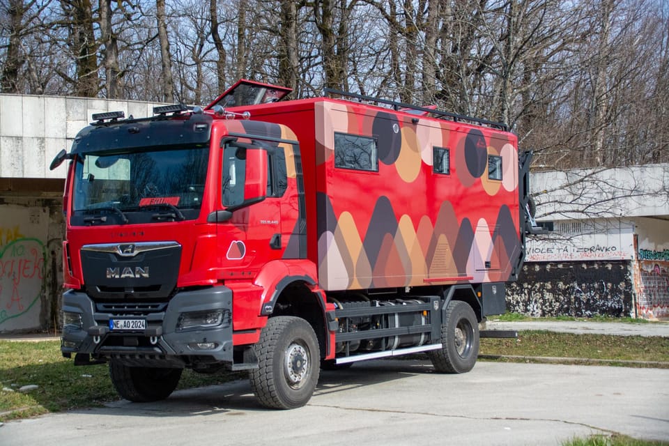 Two dreamers in a red 4x4 RV traveling the world.
